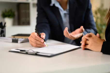 Client in a meeting going over documents