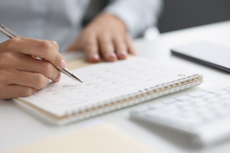 Person reviewing calendar